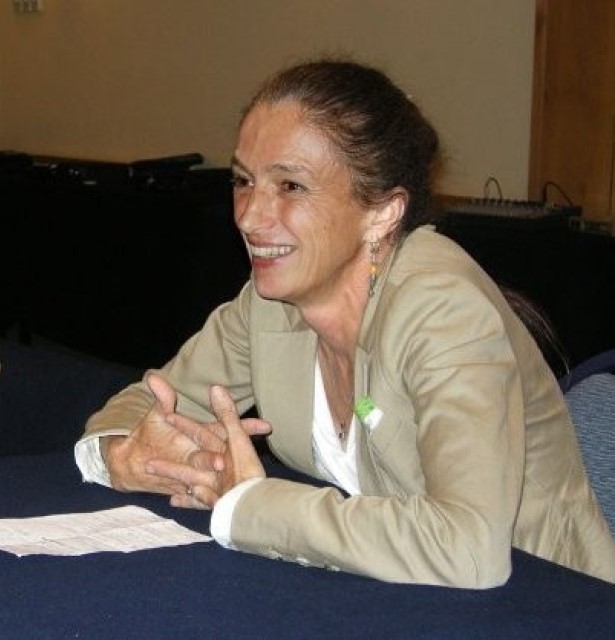 Frances Guy sitting at a conference table